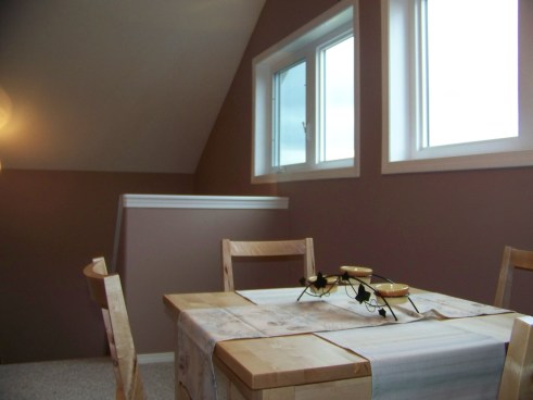 Breakfast table under windows